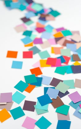 a white table topped with lots of colorful confetti
