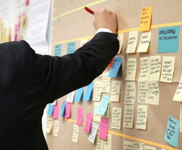 sticky notes on corkboard